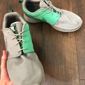 Grey and neon green Nike Roshes